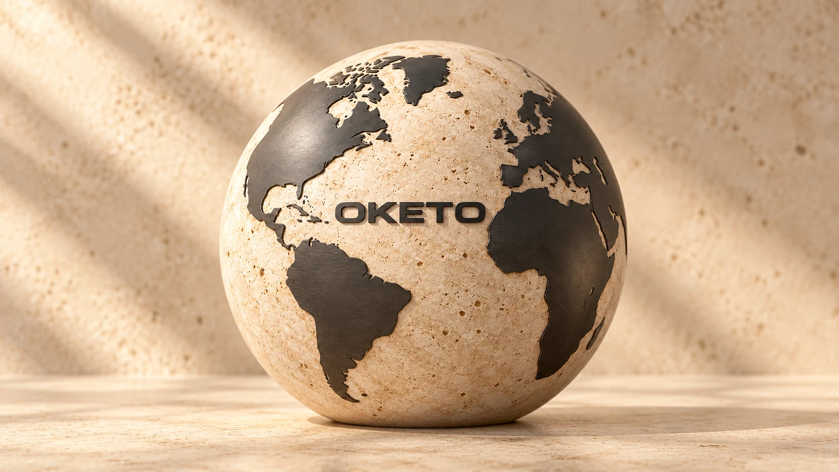 Centered OKETO globe sculpted in warm stone with dark metallic continents